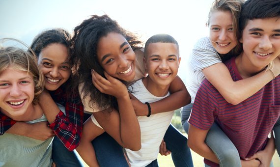 A group of smiling teenagers