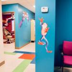 Clean and cheerful pediatric dental practice, with decorative gaming and tree frog wall decals in Florissant MO